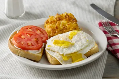 Hearty egg Cracker Barrel Famous breakfast sandwich paired with hashbrown casserole