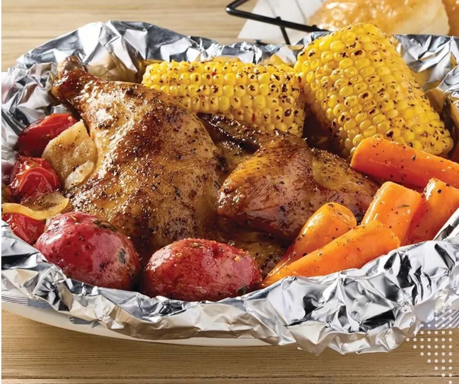 Chicken cooked campfire-style with corn and potatoes