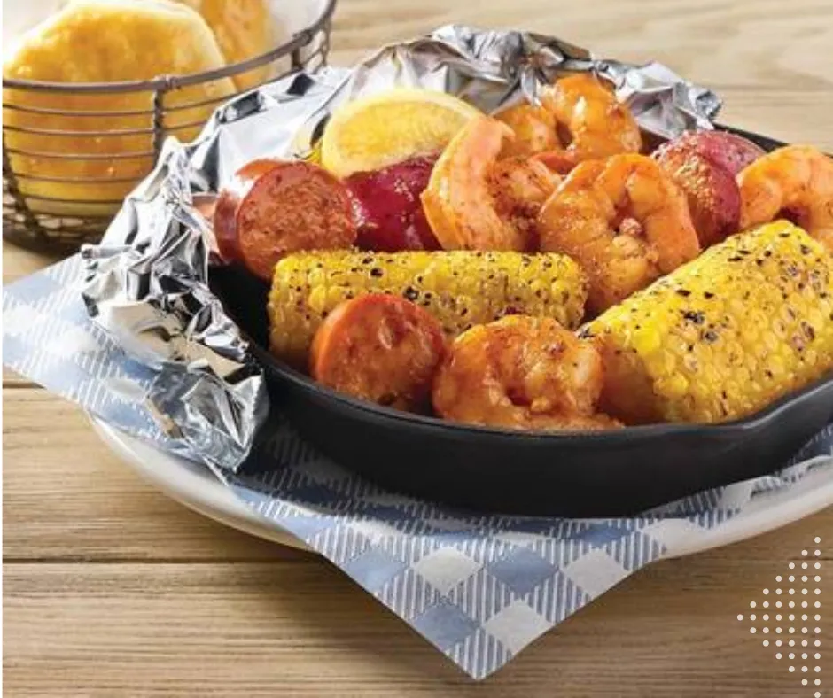 Fresh shrimp skillet cooked campfire-style with sausage and potatoes